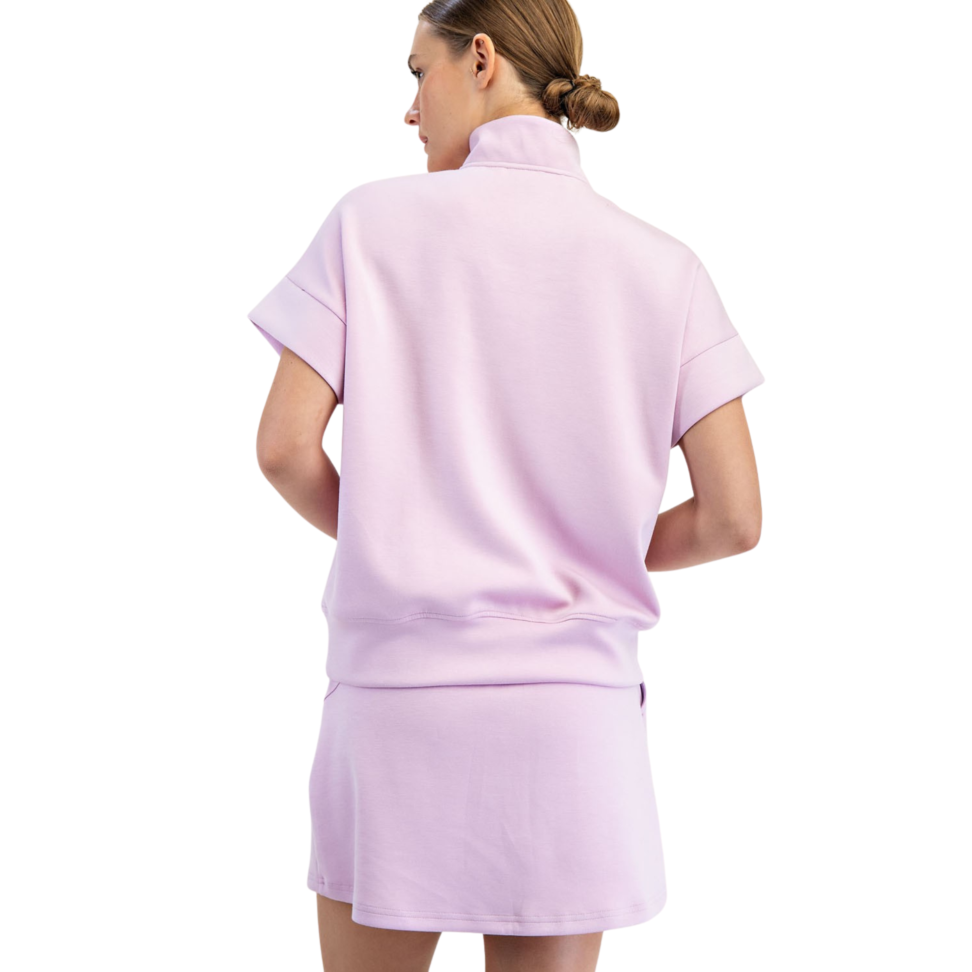 Elevate your casual wardrobe with this Modal Poly Span Quarter Zip Top from Rae Mode. Crafted in a soft lilac hue, this short-sleeve design offers effortless style and comfort for everyday wear. The quarter zip neckline provides versatile layering options, while the breathable fabric blend keeps you cool and comfortable throughout the day. Perfect for workouts, errands, or relaxed weekends.