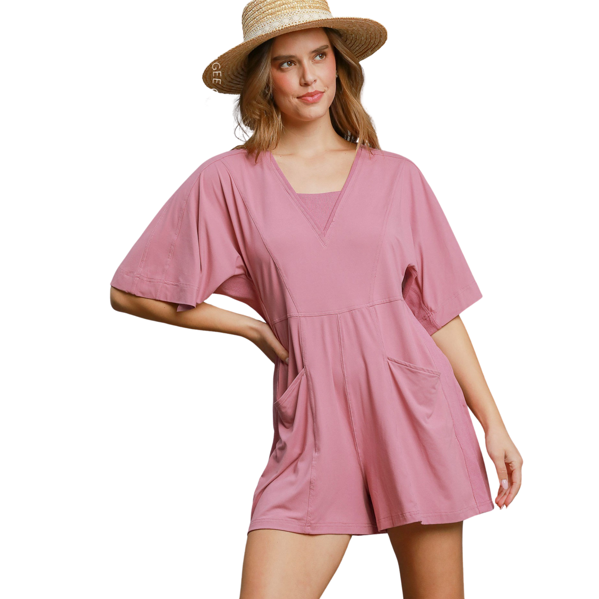 Expertly crafted by Umgee, this mauve-colored romper features a trendy half sleeve design and convenient double pockets. Stay cool and stylish with the comfortable shorts and versatile romper style. Elevate your wardrobe with this must-have piece.