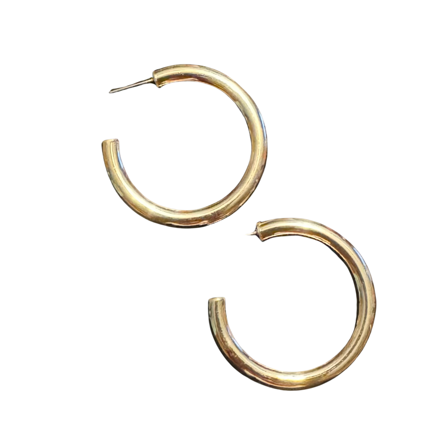 Upgrade your jewelry collection with these Medium Hoop Earrings. Crafted from high-quality gold, these earrings are perfect for adding a touch of elegance to any outfit. Their medium size makes them versatile for both casual and formal occasions. Elevate your style with these must-have hoop earrings.