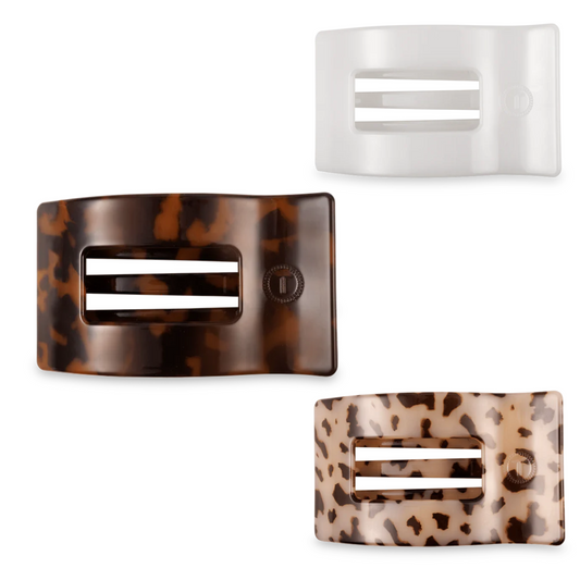 Elevate your hairstyle with these medium-sized rectangular hair clips from Teleties. Designed with a flat-back for secure hold and available in tortoise, blonde tortoise, and coconut white, these clips provide a subtle yet stylish accent suitable for various hair types and occasions. Their medium size offers versatility—perfect for sectioning or adding a polished finish to your look.