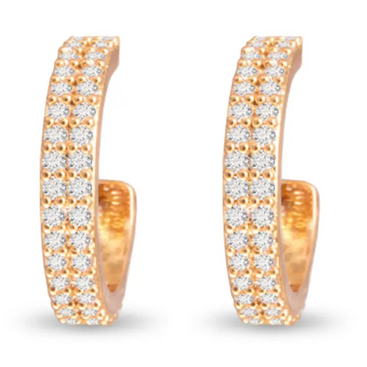 Elevate your everyday look with the Micro CZ Huggie Earrings by Amanda Blu. Crafted in gleaming gold, these tiny hoop earrings feature delicate rhinestone accents that add a subtle sparkle. Their compact design ensures a comfortable fit, making them perfect for layering or wearing alone with sophistication. Ideal for those seeking refined elegance in a minimalist style.