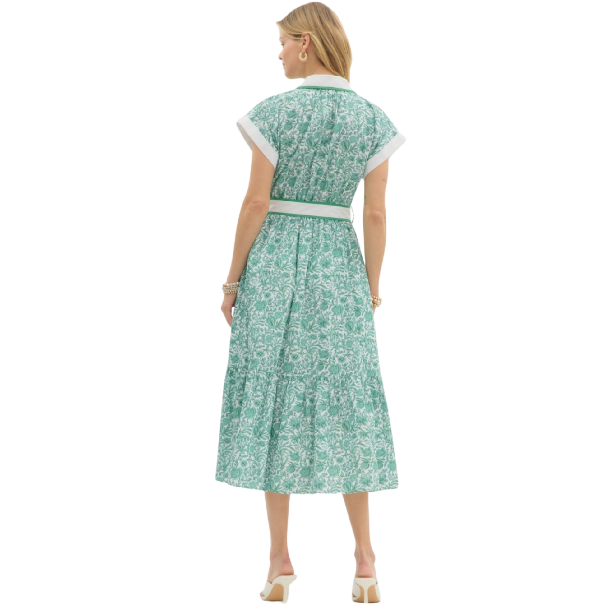 This floral midi shirtdress by Entro is both classy and sophisticated. Featuring a collared neckline, a green and white floral print, short sleeves, and a tie waist, this dress is perfect for any occasion. Stay stylish and comfortable with this versatile piece.