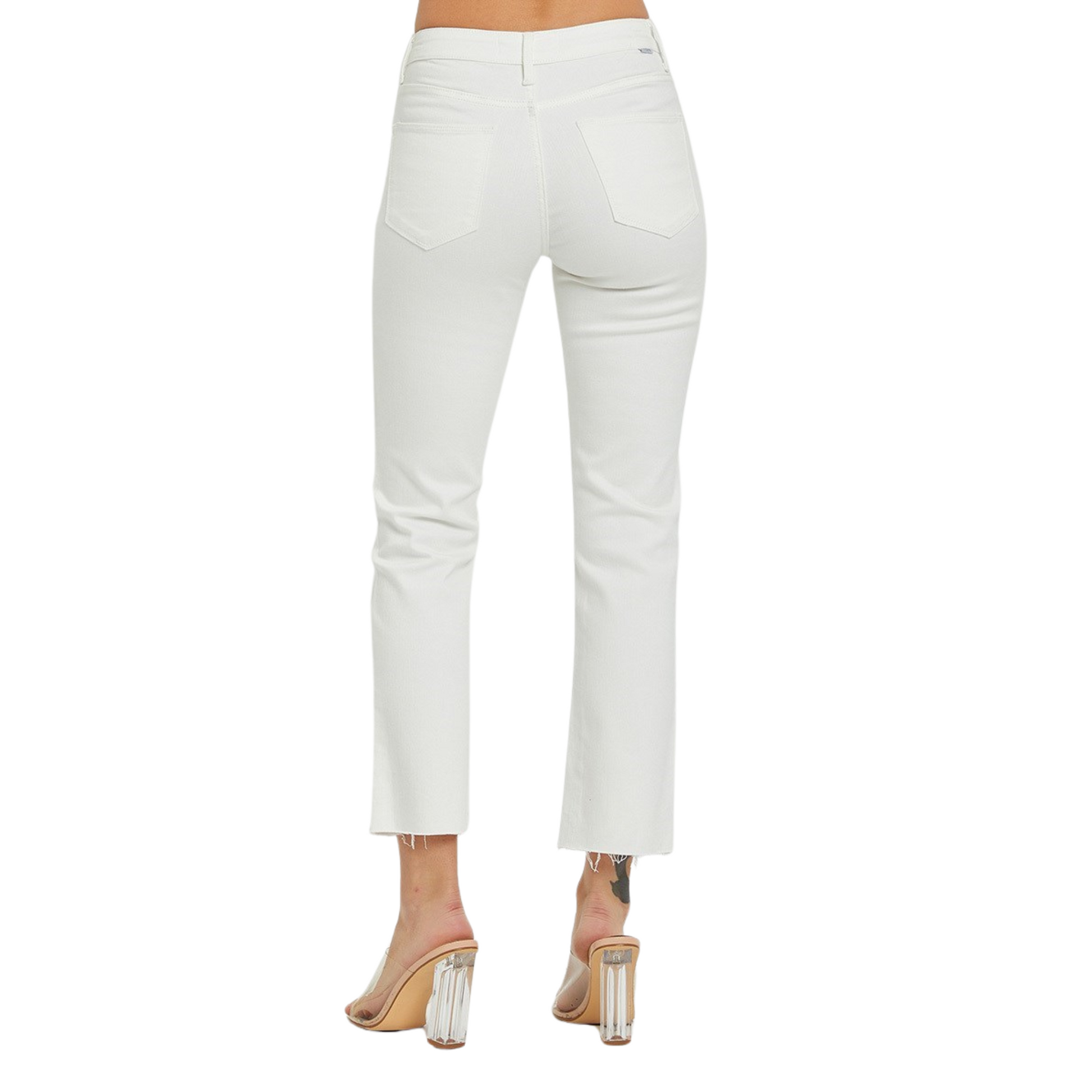 These white Mid Rise Straight Pants are the perfect addition to your wardrobe. The cropped cut and straight fit offer a stylish and flattering look, while the raw hem adds a touch of edge. Available in both regular and plus sizes for all body types.