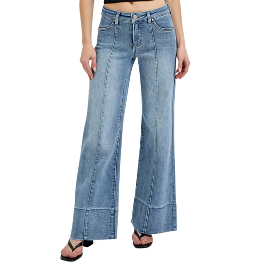 These Mid Rise Wide Flare Jeans from Risen combine a flattering medium wash with a wide leg silhouette to create a timeless, versatile look. Designed to sit comfortably at the mid-rise, they balance style and ease, while the flare shape adds movement and elongates the legs. Crafted for both casual and polished outfits, these jeans offer a sophisticated update to your denim collection.