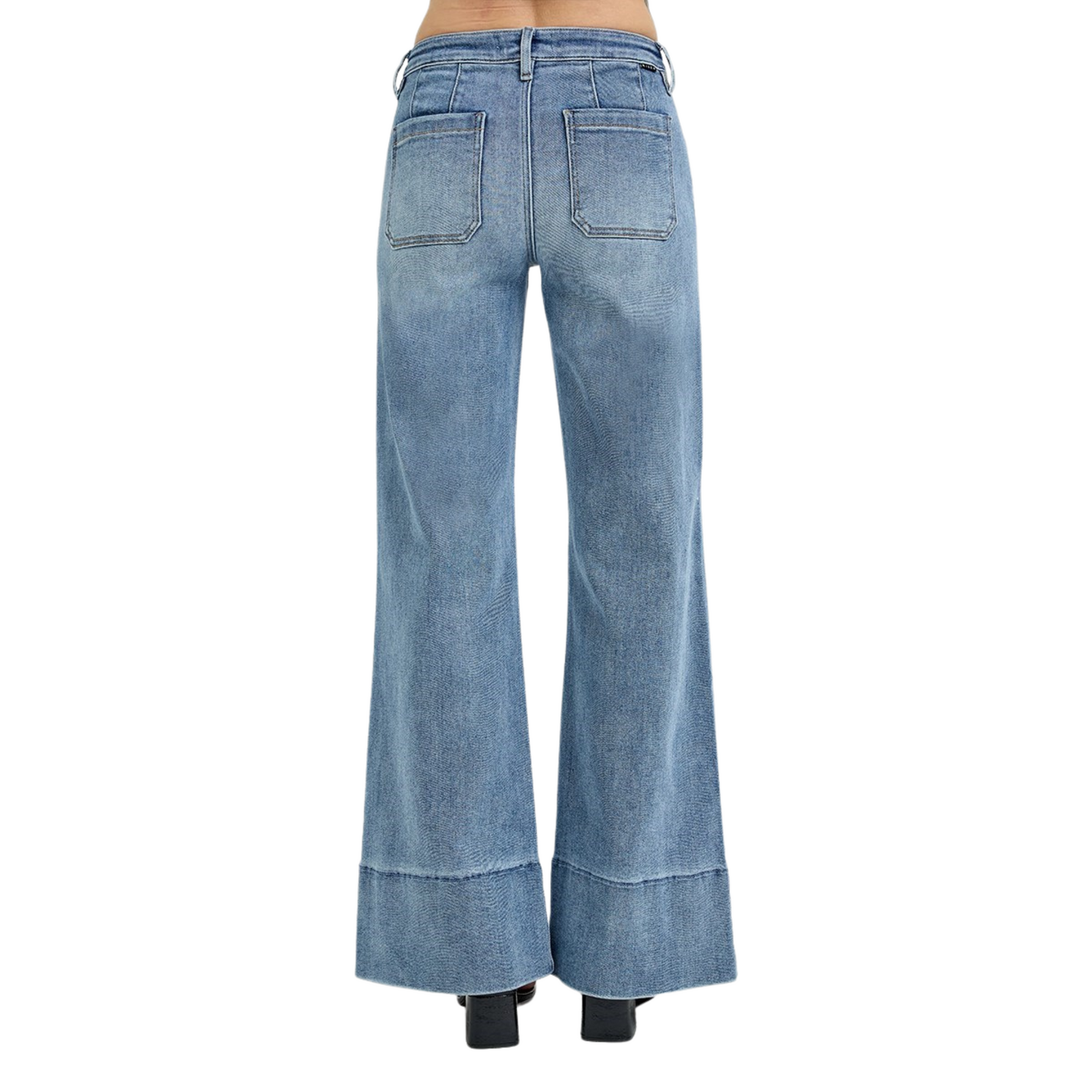 These Mid Rise Wide Flare Jeans from Risen combine a flattering medium wash with a wide leg silhouette to create a timeless, versatile look. Designed to sit comfortably at the mid-rise, they balance style and ease, while the flare shape adds movement and elongates the legs. Crafted for both casual and polished outfits, these jeans offer a sophisticated update to your denim collection.