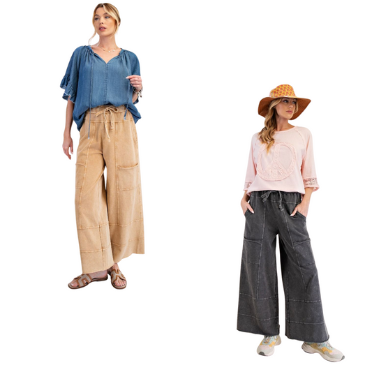 These Mineral Washed Terry Knit Pants combine comfort and style with a relaxed, loose fit enhanced by wide legs. Featuring cargo-style pockets and exposed seaming, they offer a modern utilitarian look. The elastic ruched waist with an adjustable drawstring ensures a customizable and secure fit. Available in black or camel, these pants are versatile enough for casual or elevated everyday wear.