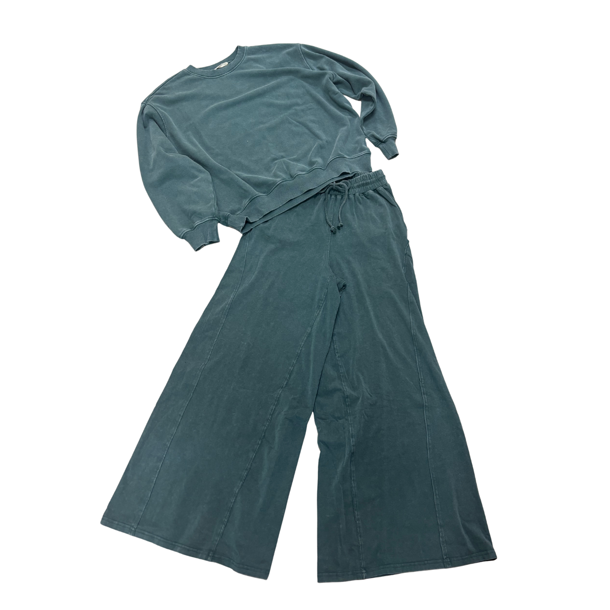 Elevate your casual wardrobe with this Double Zero dark green mineral wash top and bottom set. Featuring a relaxed-fit sweatshirt paired with matching pants, this coordinated duo offers effortless style and comfort. The soft fabric and earthy mineral wash finish create a contemporary look perfect for lounging, running errands, or casual outings. Mix and match with your existing pieces or wear the set together for a put-together aesthetic.