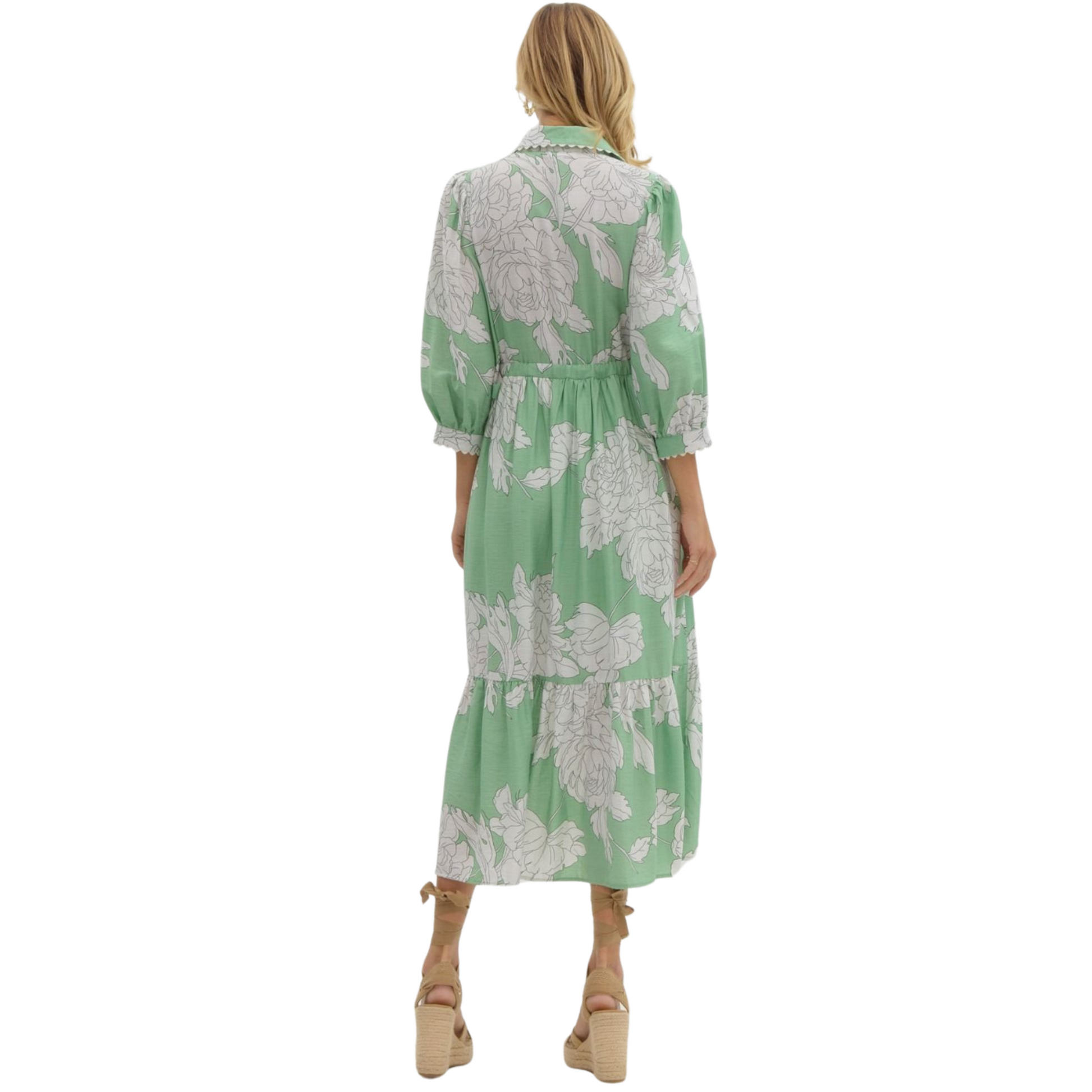 This mint green midi dress from Entro boasts a timeless style with a collared neckline and button-up front. The delicate floral print adds a touch of femininity. Made from high-quality materials, this dress is perfect for any occasion.