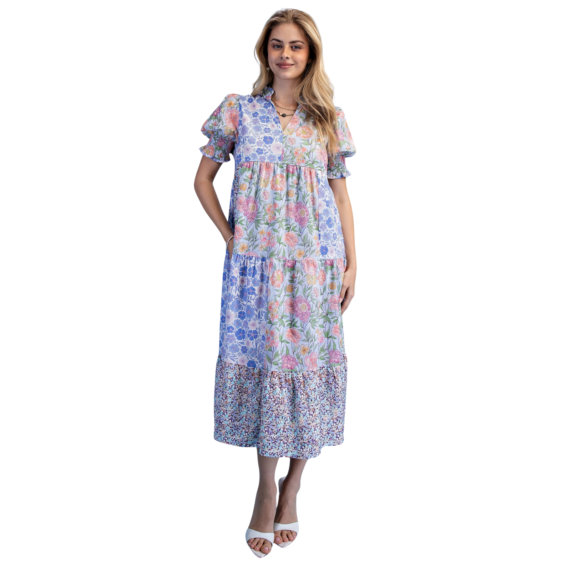 Elevate your wardrobe with this charming Mixed Print Tiered Mini Dress by GiGio. Crafted in a soft periwinkle hue, this piece features a flattering v-neck and short sleeves for effortless style. The mixed print design adds visual interest, while the tiered silhouette creates movement and dimension. Perfect for casual outings, weekend brunches, or layered styling. A versatile staple that transitions seamlessly from day to night.