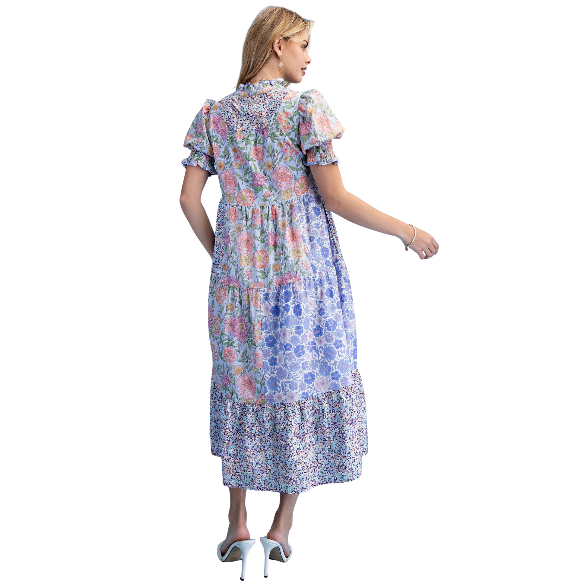 Elevate your wardrobe with this charming Mixed Print Tiered Mini Dress by GiGio. Crafted in a soft periwinkle hue, this piece features a flattering v-neck and short sleeves for effortless style. The mixed print design adds visual interest, while the tiered silhouette creates movement and dimension. Perfect for casual outings, weekend brunches, or layered styling. A versatile staple that transitions seamlessly from day to night.