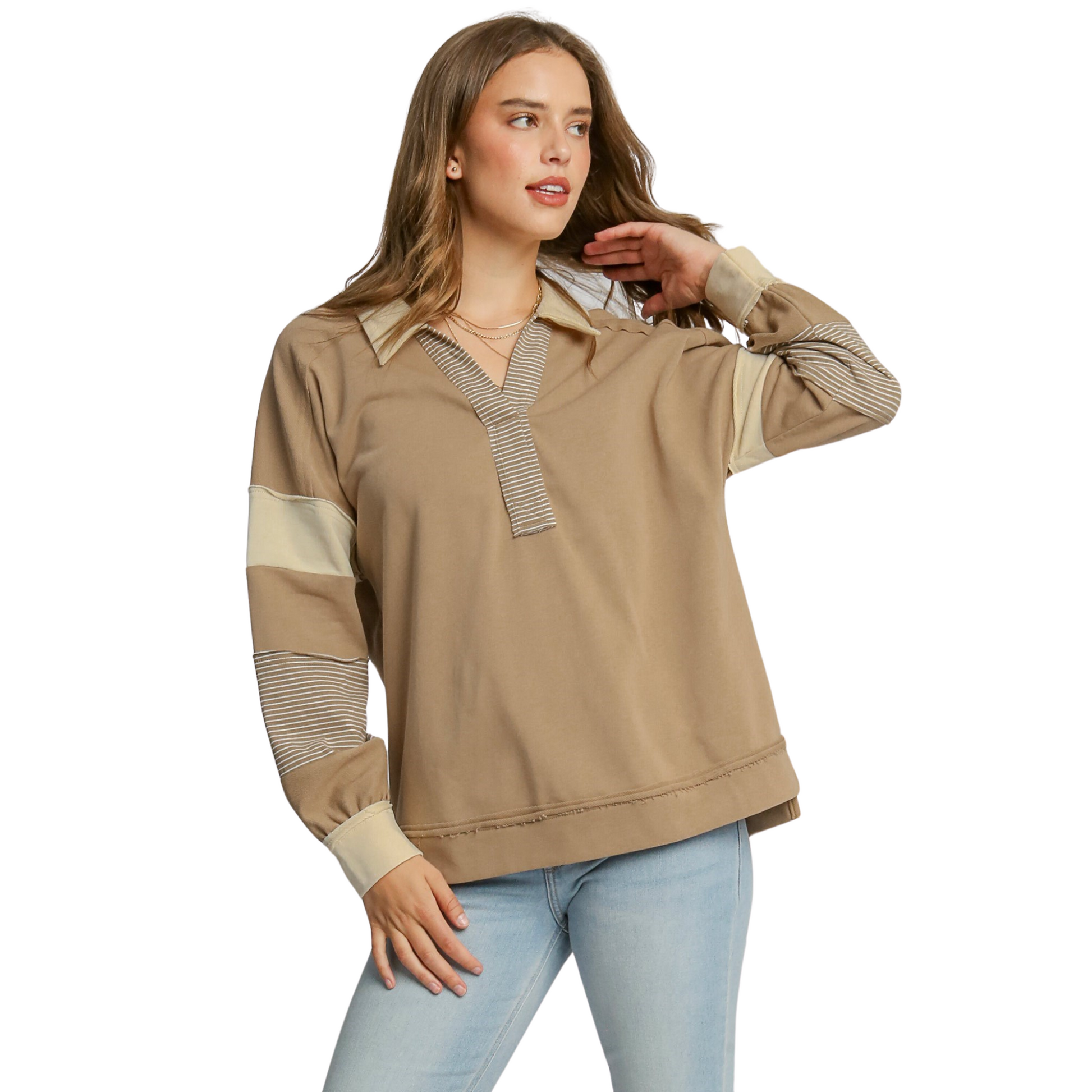 This Umgee brand French Terry Long Sleeve Top in mocha color features a mixed media design and pullover style. Its versatile and comfortable design will elevate your wardrobe while providing a polished look.