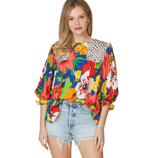 Elevate your wardrobe with this vibrant Mix Match Patterned Top from Beeson River. Featuring a bold combination of floral and animal prints, this piece brings playful energy to any outfit. The flattering 3/4 length sleeves offer the perfect balance of coverage and style, ideal for layering or wearing solo. Rich, eye-catching colors make this top a versatile statement piece that transitions seamlessly from casual days to weekend adventures. Perfect for those who love to express their unique style.