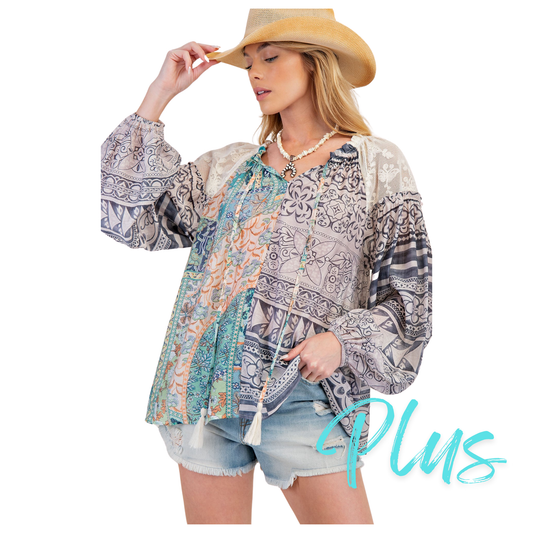 Boost your confidence with the Mix Print Loose Top by Easel. This plus size top features a loose fit and long sleeves, perfect for all-day comfort. The mixed prints add a touch of fun and flair to any outfit. Elevate your wardrobe with this must-have piece from Easel.