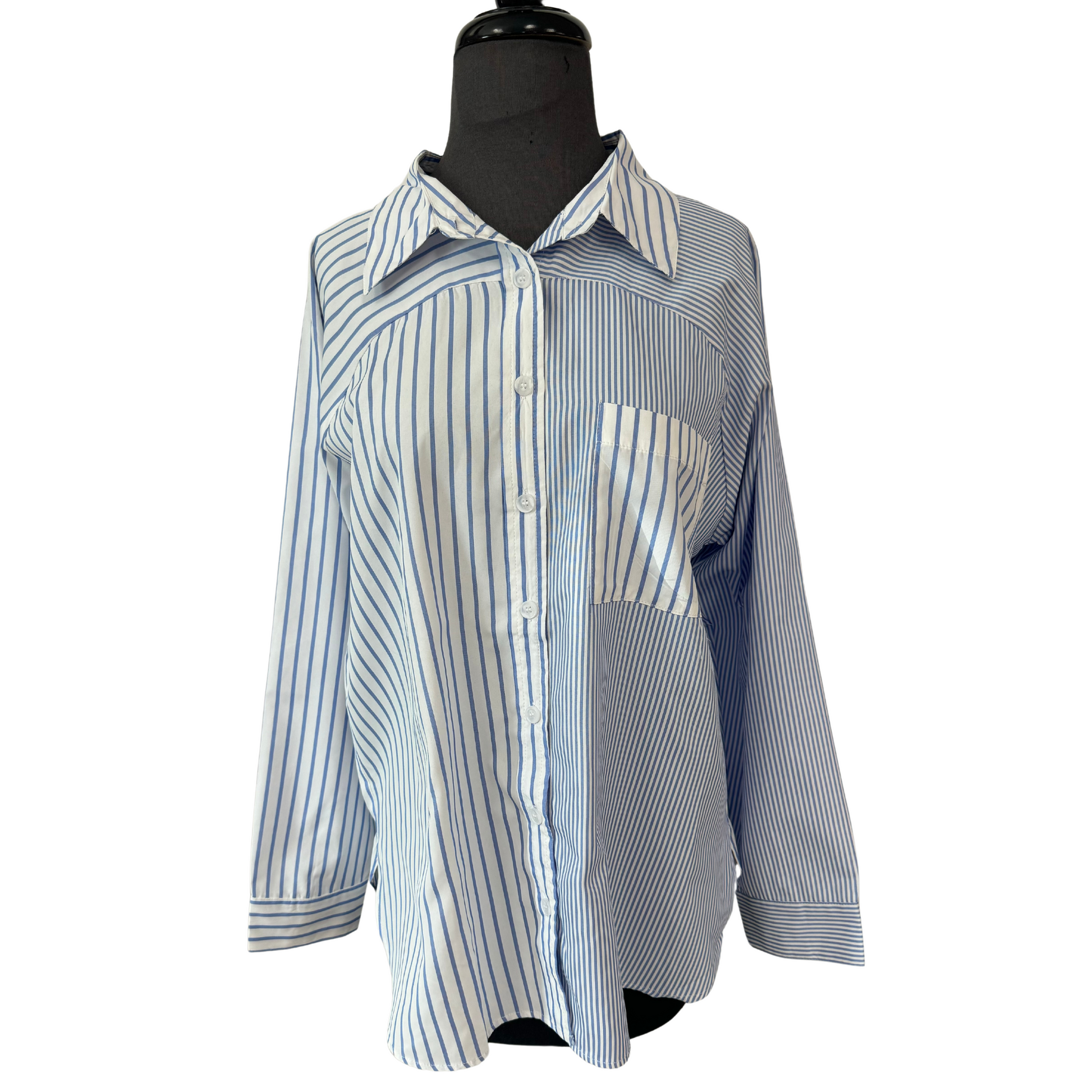 Experience both style and versatility with our Mix Print Button Up Top. This top features a bold blue and white stripe design, along with a mix print that adds a unique touch. The collared neckline and button up front offer a polished look, while the pocket adds functionality. Elevate your wardrobe with this must-have top.