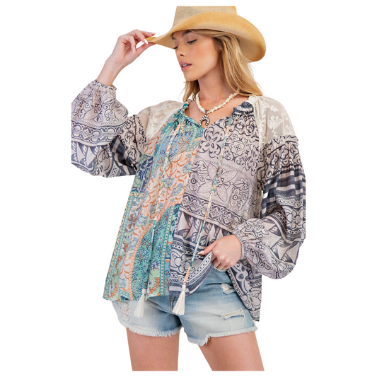 Boost your confidence with the Mix Print Loose Top by Easel. This plus size top features a loose fit and long sleeves, perfect for all-day comfort. The mixed prints add a touch of fun and flair to any outfit. Elevate your wardrobe with this must-have piece from Easel.