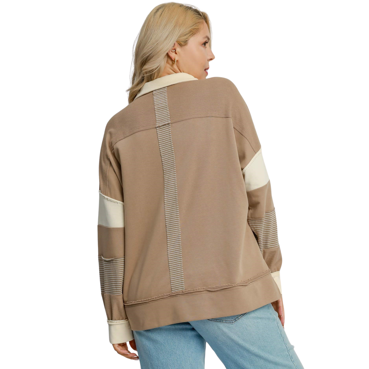 This Umgee brand French Terry Color Block Top in mocha is perfect for any plus size individual. Its mixed media design adds a touch of style while still providing ultimate comfort. A must-have addition to any wardrobe.