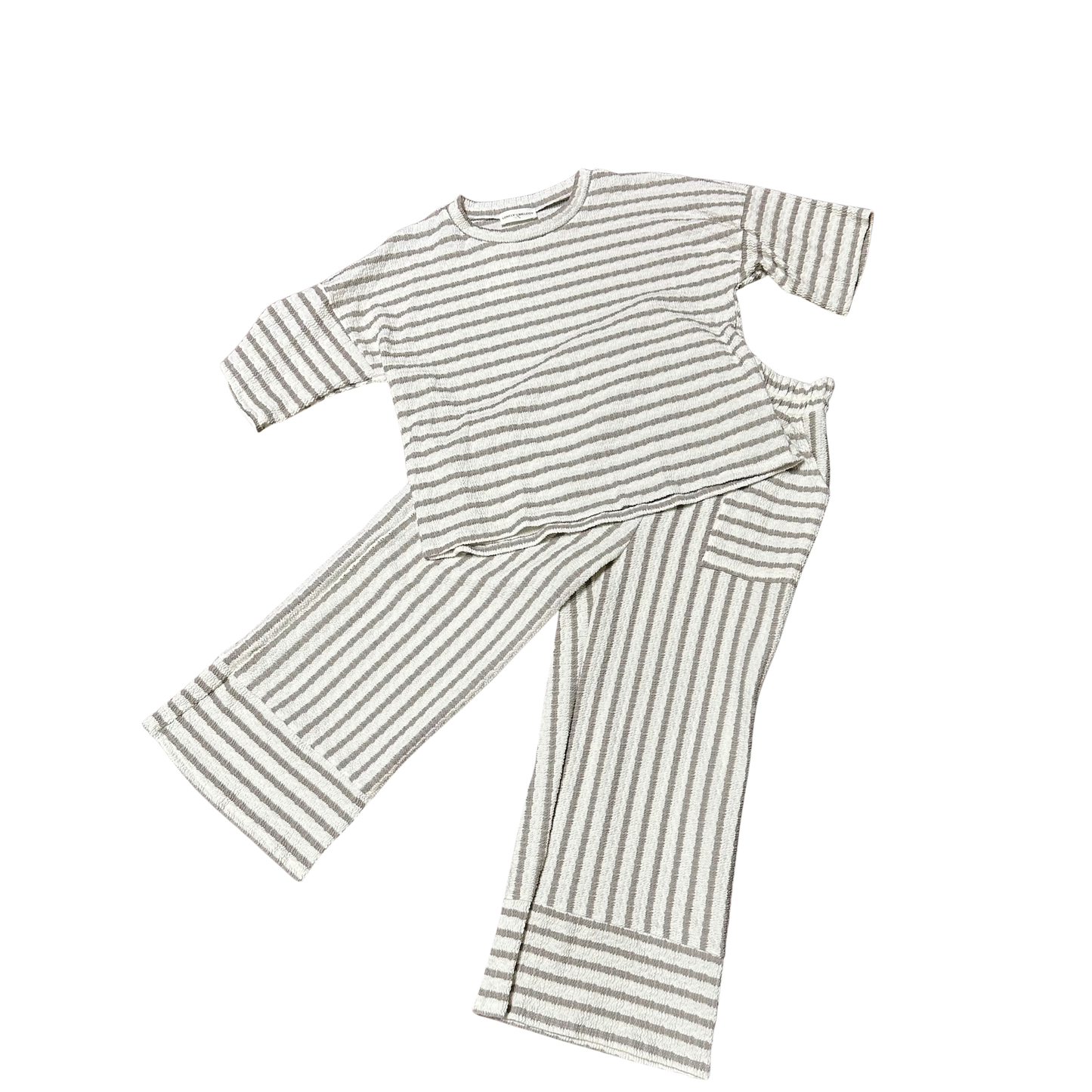 Mocha and cream striped short sleeve top paired with matching pants. This coordinated set from Lovely Melody offers effortless style with its classic color palette and timeless stripe pattern. Perfect for casual everyday wear or relaxed outings. The comfortable fit makes it ideal for all-day comfort.