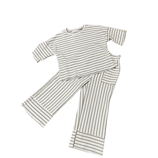 Mocha and cream striped short sleeve top paired with matching pants. This coordinated set from Lovely Melody offers effortless style with its classic color palette and timeless stripe pattern. Perfect for casual everyday wear or relaxed outings. The comfortable fit makes it ideal for all-day comfort.