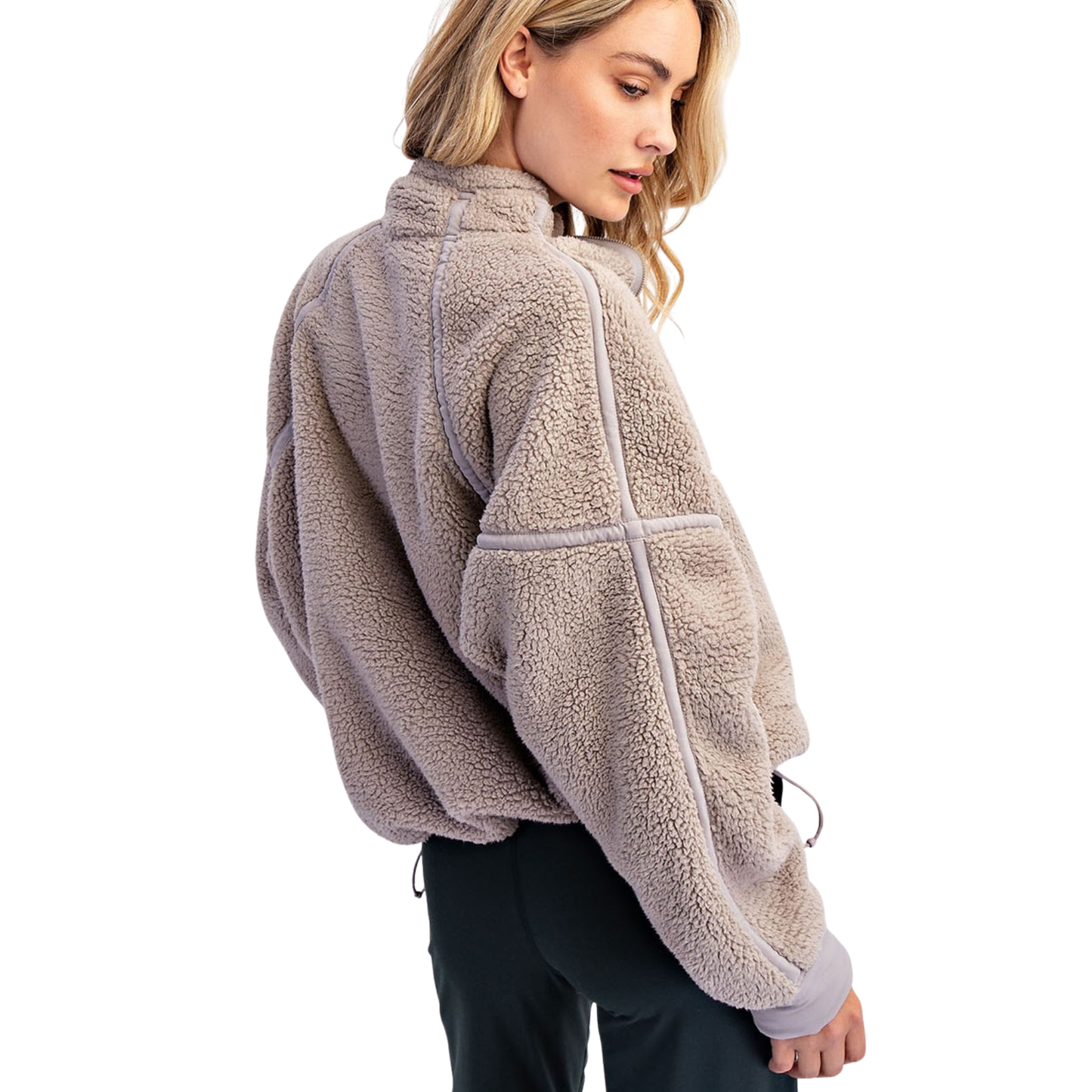 Experience ultimate warmth and style with the Rae Mode Mock Neck Sherpa Jacket. Crafted in a versatile taupe shade, this quarter-zip pullover features plush sherpa fabric that provides exceptional comfort and insulation. Its mock neck design offers added protection against chilly winds, making it ideal for layering in colder weather. Perfect for both casual outings and outdoor adventures, this jacket combines cozy softness with functional style for reliable all-day wear.