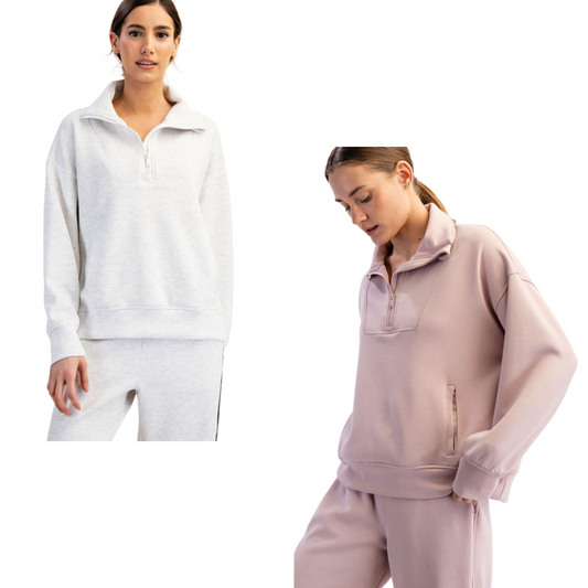 The Modal Scuba Quarter Zip Pullover by Rae Mode combines a sleek mock neck and functional quarter zip for versatile layering. Crafted from soft modal fabric, it ensures comfort and smooth wear. Available in mauve and light heather grey, this pullover suits both regular and plus sizes, offering an expert blend of style and fit for everyday wear.