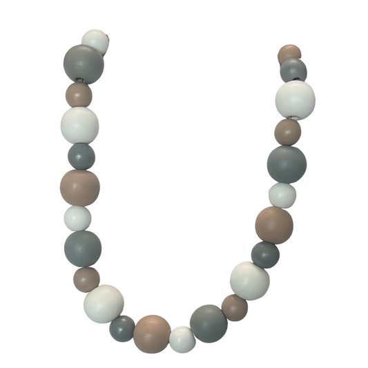 This expert-crafted short necklace from Golden Stella features a harmonious arrangement of wooden beads, offering natural texture and warm earth tones. Its lightweight design ensures comfortable wear while adding a subtle, sophisticated accent to any outfit. Perfect for layering or standalone wear, this multi-beaded piece exemplifies timeless craftsmanship and versatile style.