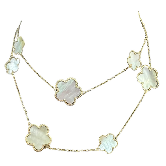Experience timeless elegance with our Multi Clover Necklace. Made of luxurious gold, this long necklace features a stunning clover design accentuated by a mother of pearl center. Elevate any outfit with this sophisticated piece, perfect for any occasion.