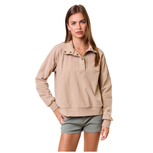 Elevate your wardrobe with the Brushed Knit Sweatshirt in a sophisticated mushroom color. Featuring a mock neck and delicate buttons, this piece combines refined details with everyday comfort. The buttery-soft fabric offers a gentle touch against the skin, making it an ideal choice for layering or solo wear. Designed by Doe and Rae, this sweatshirt balances style and coziness with expert craftsmanship.