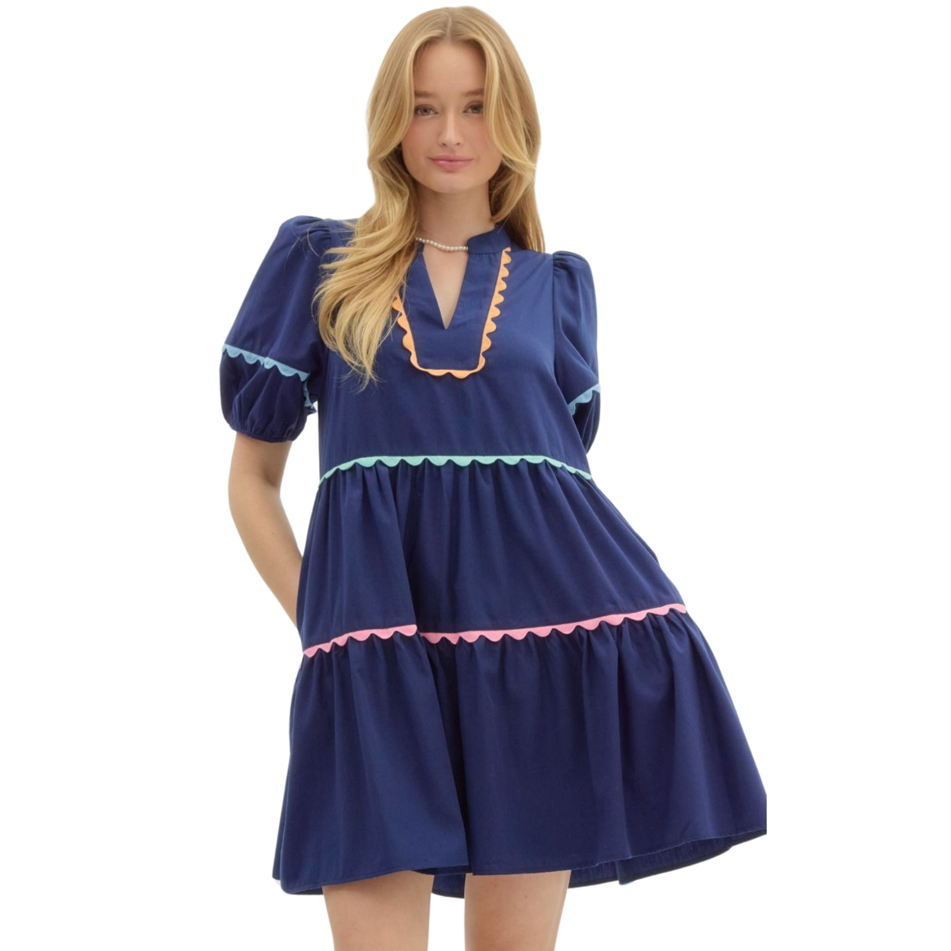 Experience comfort and style with our Entro Babydoll Pullover Mini Dress. Featuring a solid color and short lantern sleeves, this dress also includes pockets and multicolor scallop accent trims. Lined and lightweight, it's perfect for any occasion. Non-sheer and easy to wear, get yours in navy today.