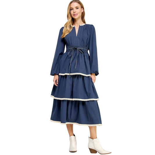 Look effortlessly chic in our Lace Trim Detail Poplin Dress. This midi dress combines comfort and style with its V neckline, elasticated cuffs, and stretch smock waist. The lace trim and tiered maxi skirt add a touch of elegance. Perfect for any occasion, this dress also comes with a removable waist tie for added versatility.