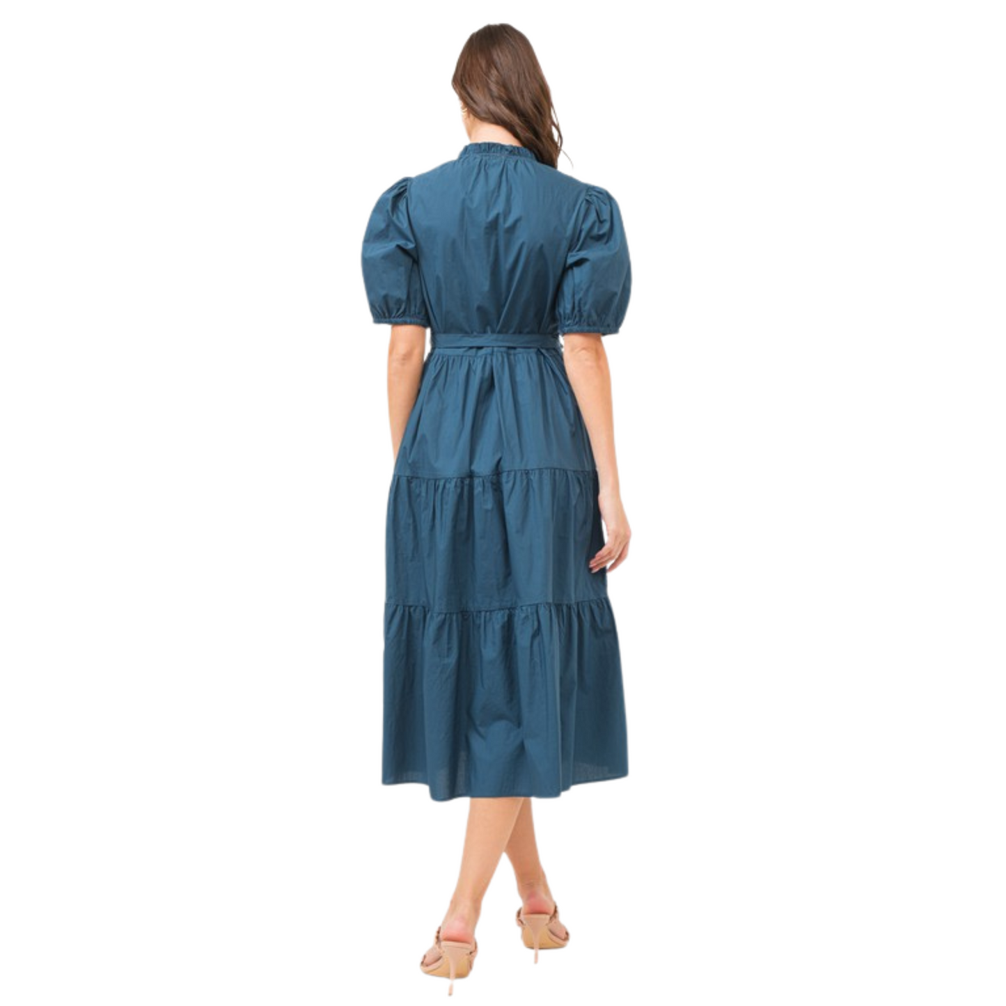 Expertly crafted from sleek navy fabric, this Tiered Midi Dress is the epitome of understated elegance. With its midi length and v-neck design, it flatters every figure. The belted waist cinches to accentuate your curves, while the short sleeves provide versatile styling options. Perfect for any occasion, this dress is a must-have for every wardrobe.