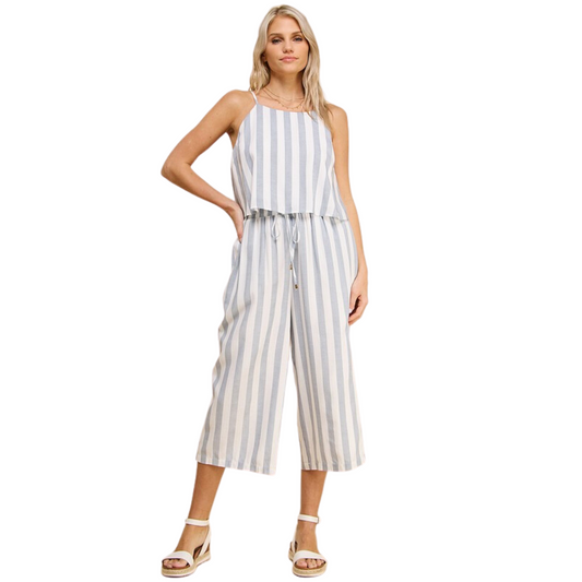 These Woven Culottes feature a classic white and navy striped pattern and a drawstring waist for a comfortable fit. Crafted from lightweight linen, they offer a contemporary cropped silhouette and breathability for all day comfort and style.