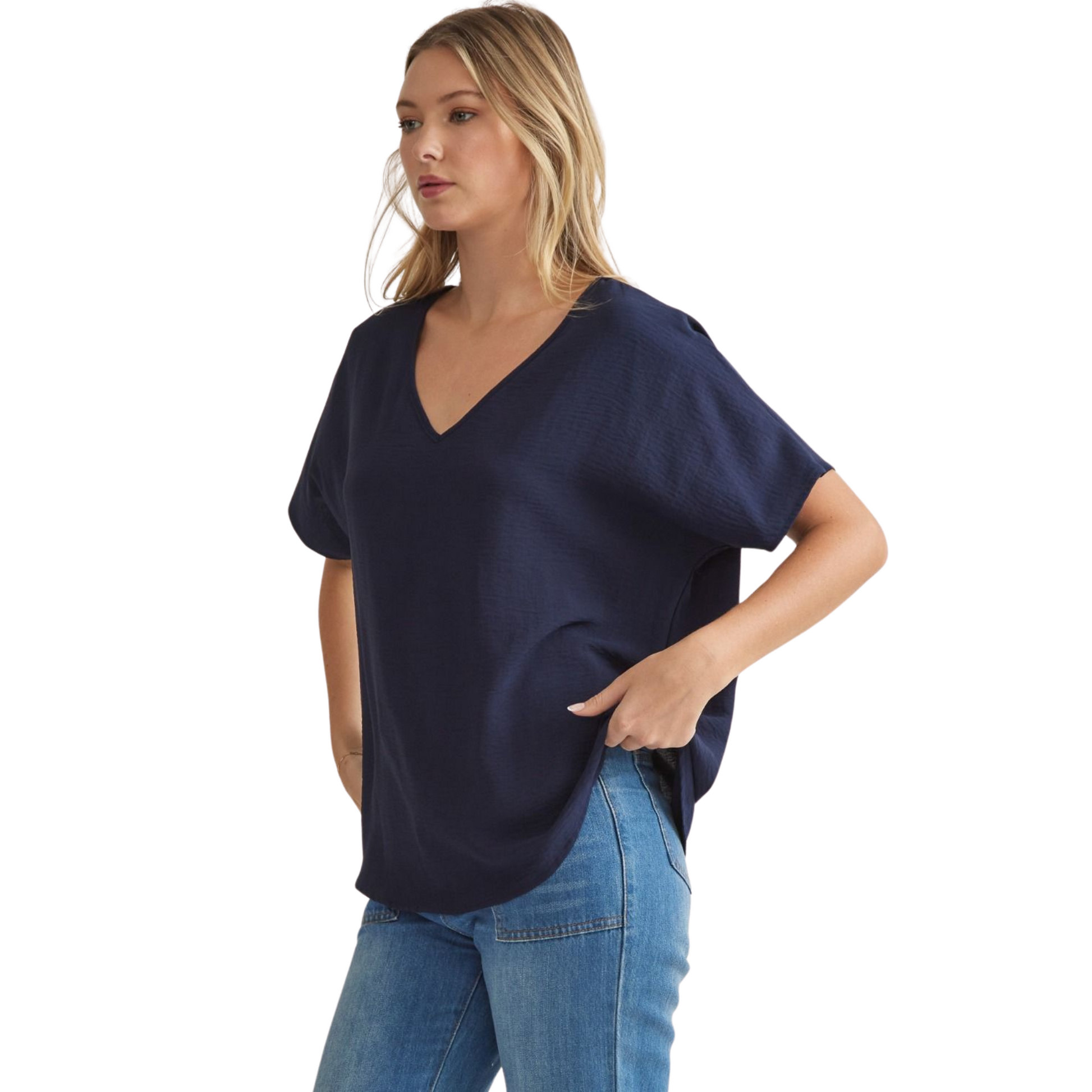 This navy solid v-neck top features an asymmetric rounded hem detail that adds a unique touch to any outfit. Made with lightweight, semi-sheer woven fabric, this top is perfect for all-day wear. Look effortlessly stylish and feel comfortable at the same time.