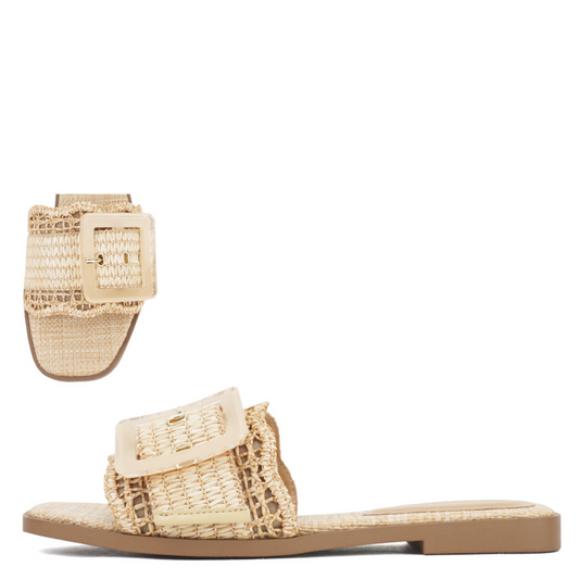 Experience effortless style with the Nayan flat sandal, crafted from natural raffia for a breathable, eco-friendly feel. Its open-toe design and easy slide-on silhouette offer comfort and convenience, making it an ideal choice for warm-weather wear. Perfectly blending casual elegance with expert craftsmanship, this sandal complements any relaxed or refined outfit.