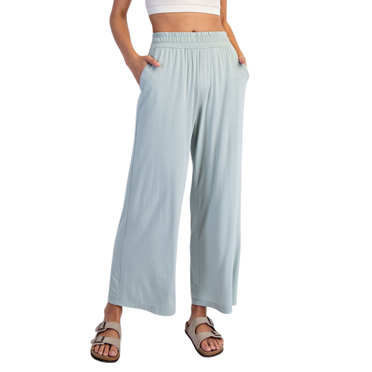 Effortless comfort meets contemporary style with these Rae Mode viscose modal wide leg pants. Crafted in a luxurious moss green hue, these pants feature a relaxed wide leg silhouette that flatters every frame. The elastic waist provides all-day comfort and ease of movement, making them perfect for casual outings or relaxed workdays. The soft, breathable viscose modal fabric drapes beautifully while maintaining its shape. A versatile wardrobe essential that transitions seamlessly from day to night.