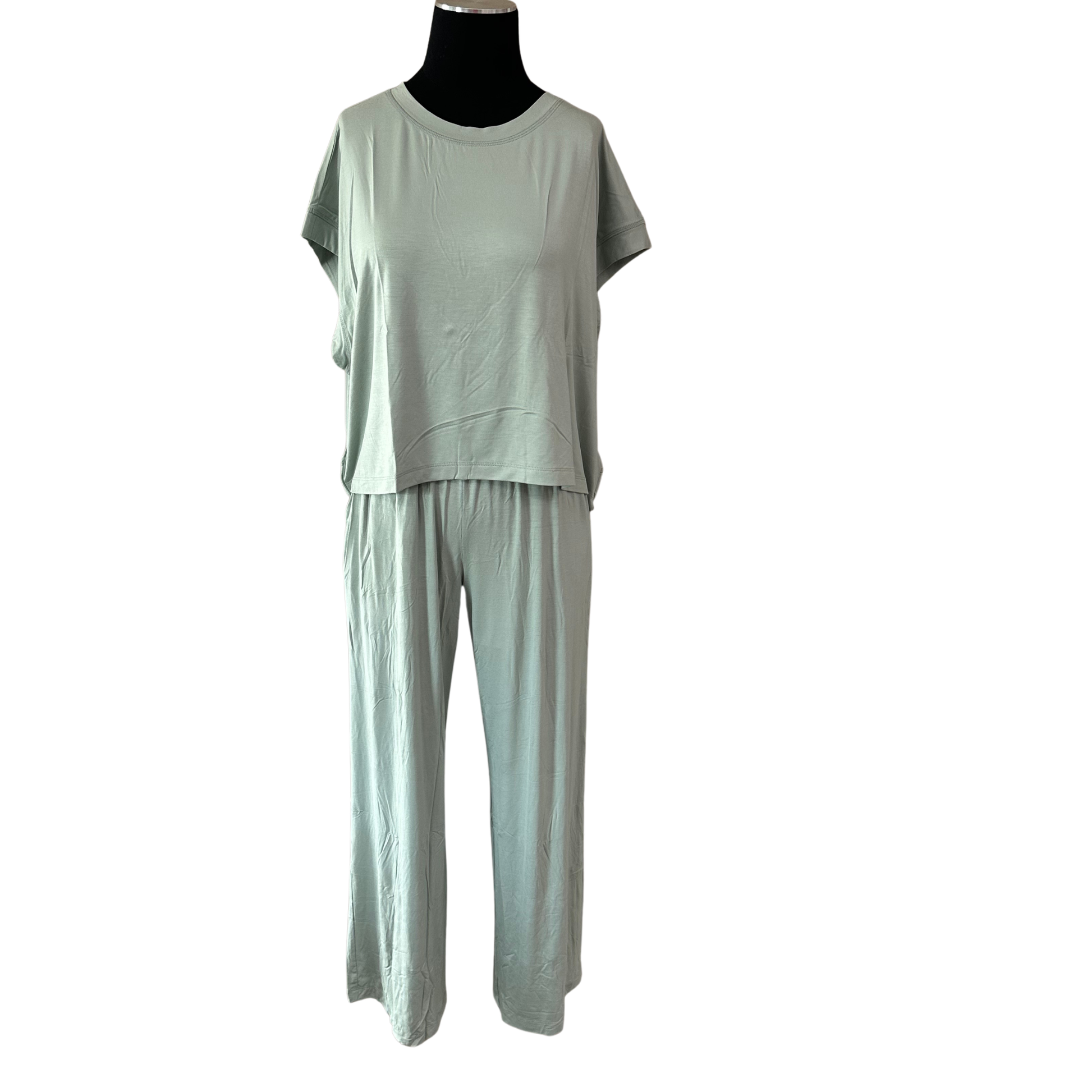 Elevate your casual wardrobe with this effortless two-piece set from Rae Mode. The moss green open back short sleeve top features a modern silhouette that's perfect for layering or wearing solo, while the matching wide leg pants offer comfort and contemporary style. This versatile pairing works seamlessly for weekend outings, casual brunches, or relaxed evenings out. 
