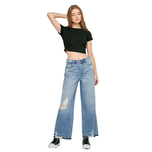Our Nori High Rise Wide Leg Jeans offer the perfect mix of style and comfort. Crafted from medium wash denim with distressed details, they flatter every figure with their wide leg fit, high rise waistline, and soft stretch fabric. Get a timeless look with these classic jeans.