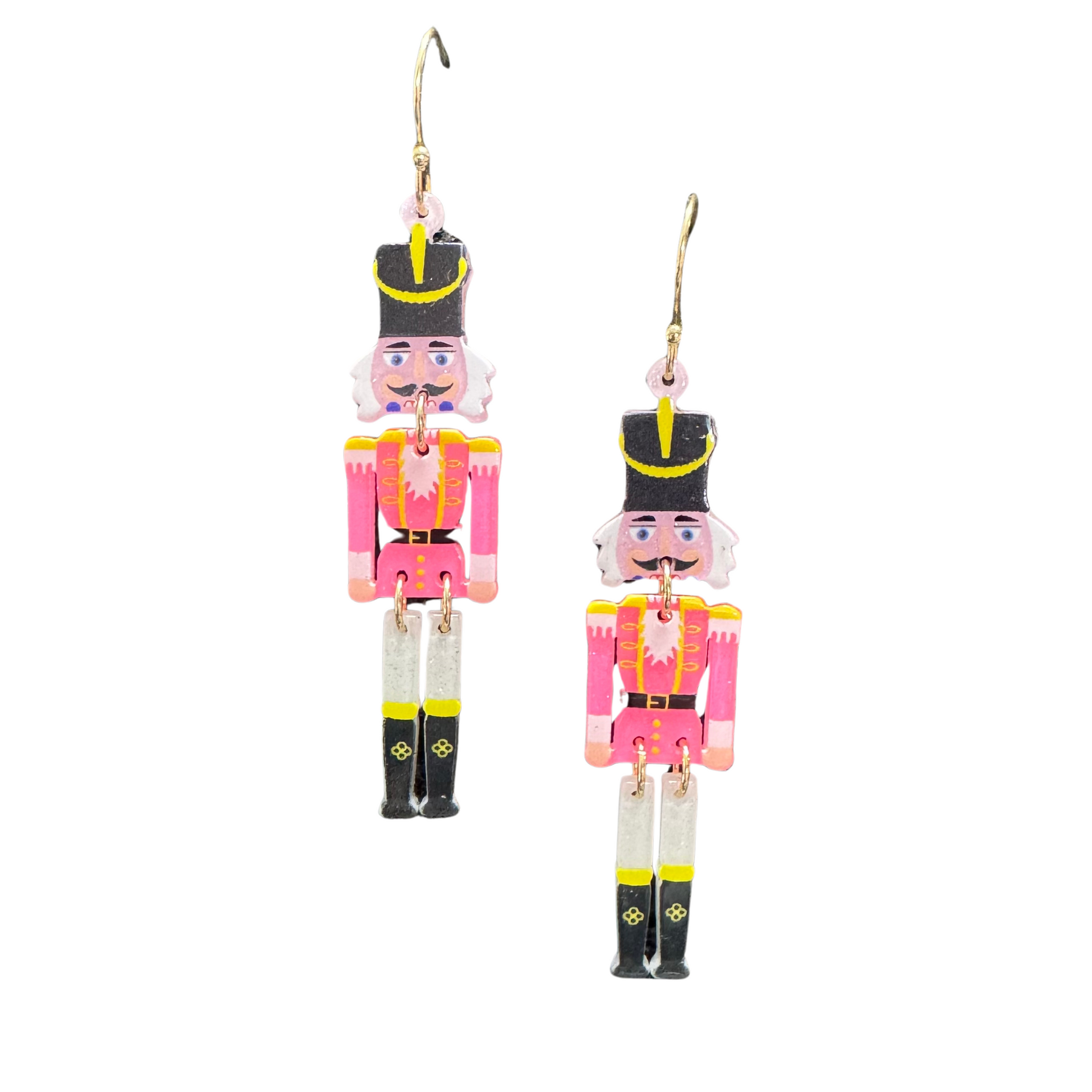 These Nutcracker Dangle Earrings feature a festive and unique nutcracker design, making them the perfect accessory for the holiday season. The dangle style adds a touch of elegance to any outfit. Celebrate Christmas in style with these statement earrings.