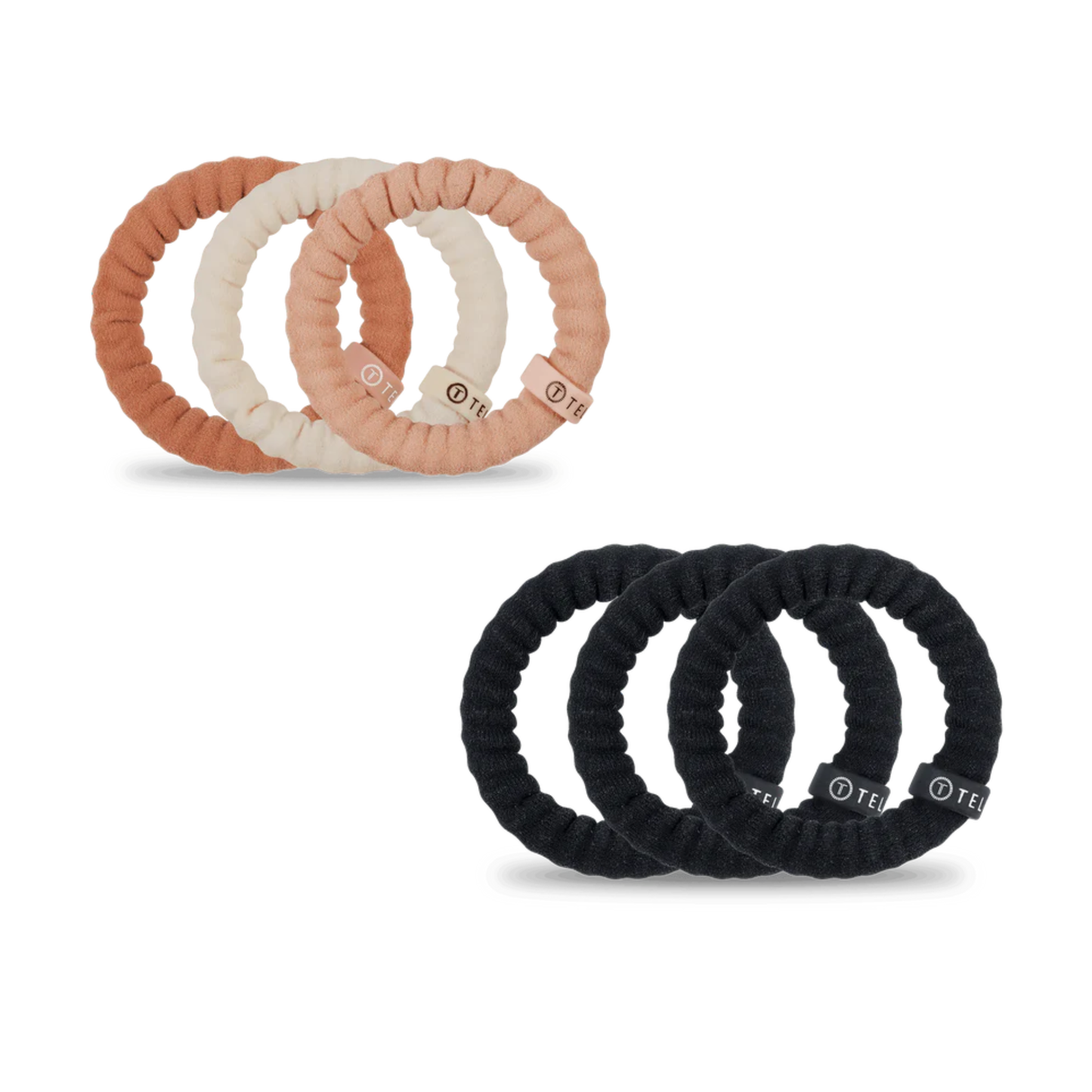 Teleties small nylon hair ties in two versatile shades: For The Love of Nudes and Jet Black. These lightweight, gentle hair ties are designed to hold your style without creasing or damaging your hair. Perfect for everyday wear, workouts, or securing delicate updos. The smooth nylon construction glides through hair smoothly while providing secure hold. Available in both neutral and classic black to match any look.