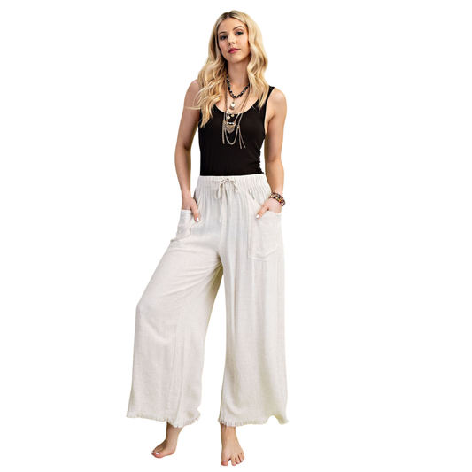 Elevate your casual wardrobe with these GiGio Frayed Cropped Wide Leg Pants in a versatile oatmeal hue. Designed for plus-size figures, these pants feature a comfortable drawstring waist for an adjustable, personalized fit. The cropped wide-leg silhouette offers a modern, flattering cut that works for any body type. Perfect for layering with your favorite tops, these pants deliver effortless style and comfort for everyday wear.