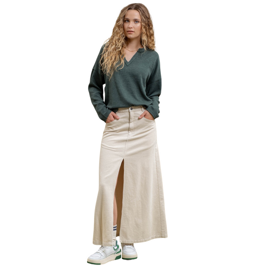 This oatmeal colored, Blu Pepper brand Corduroy Maxi Skirt features a high waist, button and zipper front detail, belt loops, pockets, split front, and a corduroy pattern. Its maxi length provides a classic, sophisticated look, while the corduroy material adds texture and warmth. Perfect for a chic, yet cozy outfit.