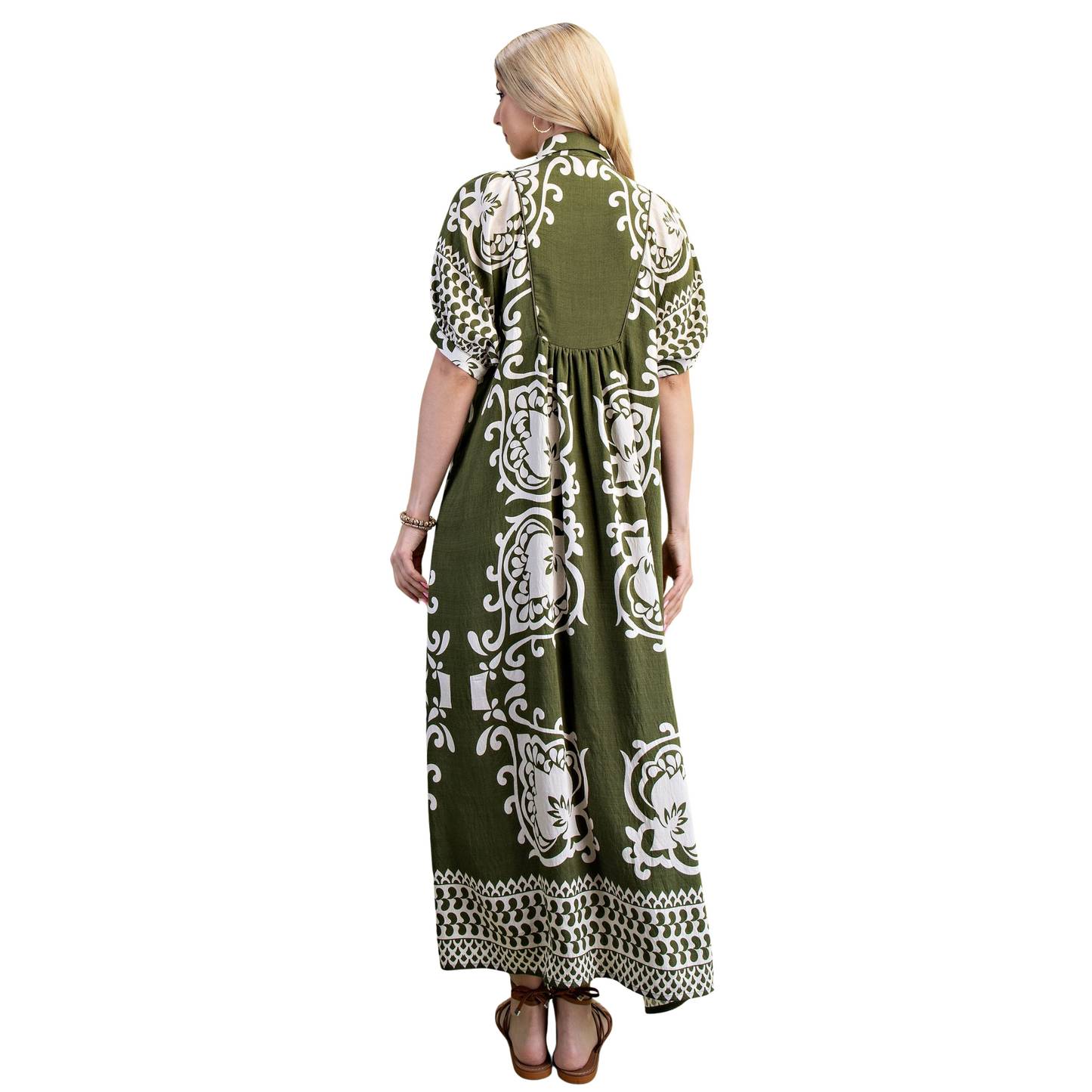 This GiGio puff sleeve midi dress features a sophisticated olive color combined with a unique mixed print, offering a refined yet contemporary look. The voluminous puff sleeves add a touch of elegance and structure, while the midi length ensures versatile wear for various occasions. Crafted to balance style and comfort, this dress is an expert choice for those seeking a distinctive, fashion-forward piece.