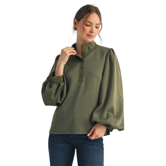 Elevate your wardrobe with the Jodifl Button Up Mock Neck Top, crafted in an elegant olive hue. This long sleeve design features a sophisticated mock neck paired with a classic button-up front, offering a polished yet comfortable fit. Ideal for layering or wearing alone, it balances style and versatility, making it a refined choice for both professional and casual settings. The subtle olive color adds a contemporary touch that complements a variety of outfits.