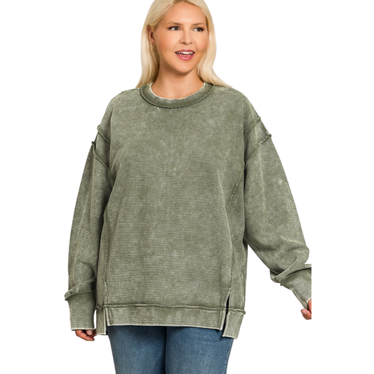 Zenana's plus-size ribbed sweatshirt combines comfort with contemporary style in a sophisticated dark olive hue. The ribbed texture adds visual interest and structure, while long sleeves provide versatile layering for any season. Crafted for a flattering fit, this sweatshirt transitions effortlessly from casual weekends to relaxed workdays. The acid-washed finish delivers an on-trend aesthetic that pairs well with your existing wardrobe staples.
