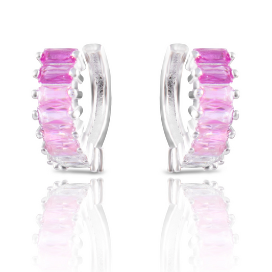 Expertly designed, these Ombre Bagette Huggie Earrings feature a stunning pink and silver ombre design. The small hoops add a touch of elegance, making them perfect for any occasion. Elevate your style with these unique, eye-catching earrings.