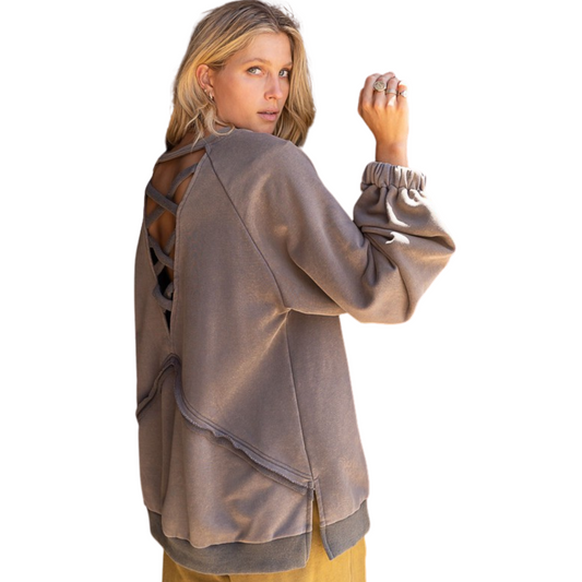 This Open Back Balloon Sleeve Sweatshirt has a relaxed fit for maximum comfort. Its unique balloon long sleeves with outseam details and cross strap back design details make it a stand-out style. The side slits and french terry sweater top provide breathability and an extra touch of style.