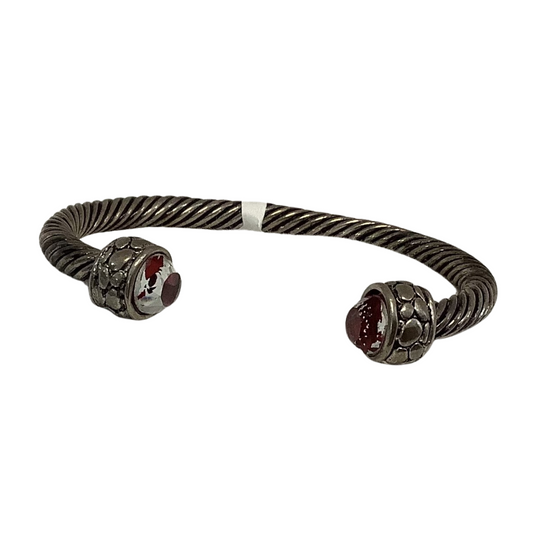 This elegant Twisted Bangle Bracelet is crafted from high-quality sterling silver and features intricate bead accents, offering an eye-catching style that will add an extra touch of sophistication to your wardrobe. The open-ended cuff style ensures a comfortable fit on any wrist.