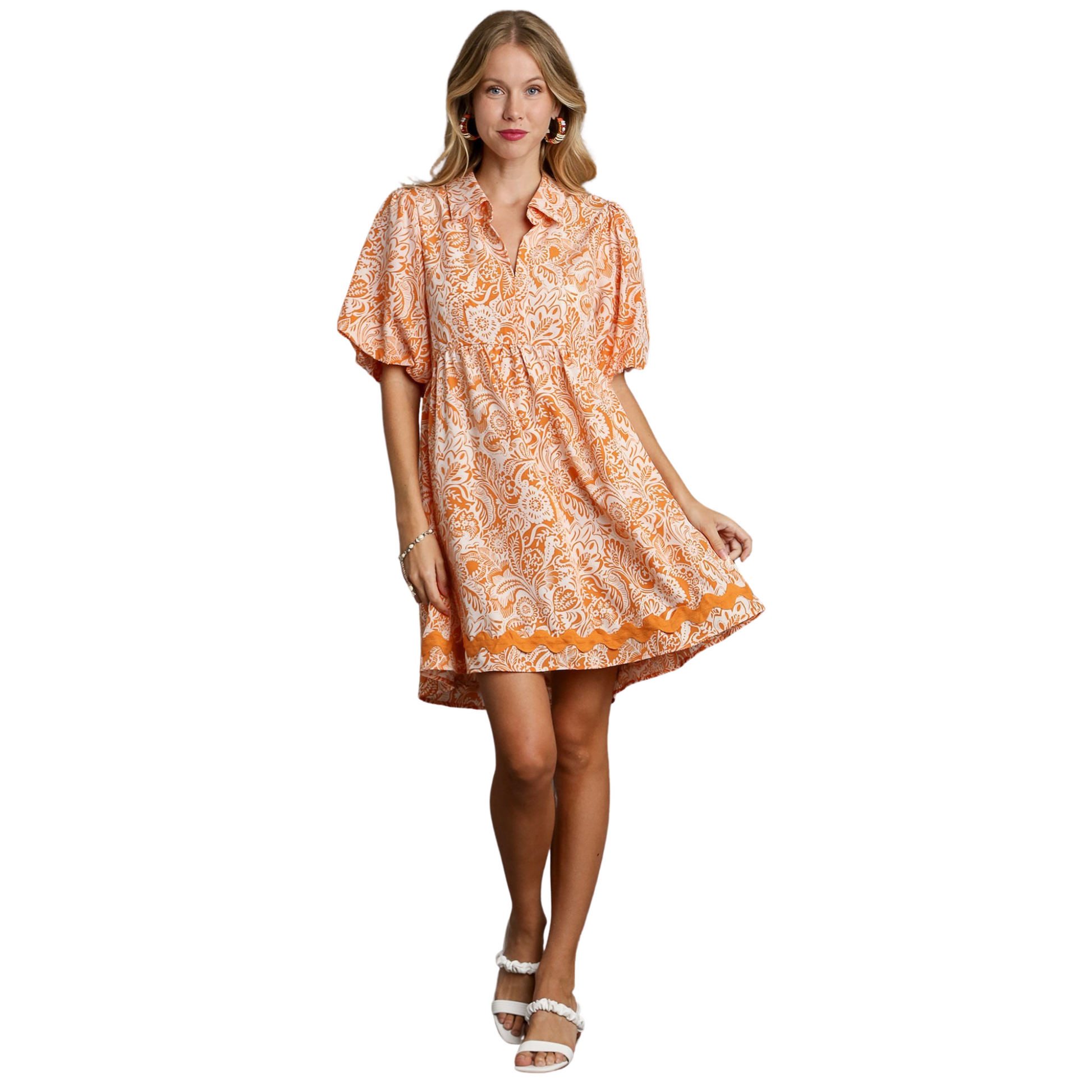 This two tone balloon sleeve dress is the perfect addition to your wardrobe. The orange and white colors create a striking contrast, while the balloon sleeves add a touch of elegance. Made with high-quality materials, this mini dress is both stylish and comfortable. Elevate your outfit and make a statement with this versatile piece.