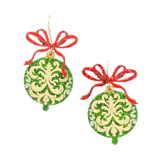 Celebrate the holiday season with the Golden Stella Christmast Ornament Earrings. These elegant dangle earrings capture festive charm, adding a sophisticated sparkle to your holiday attire. Expertly crafted to embody the spirit of Christmas, they make a perfect accessory for seasonal gatherings or a thoughtful gift for loved ones. Embrace the joy of the holidays with a touch of timeless style.