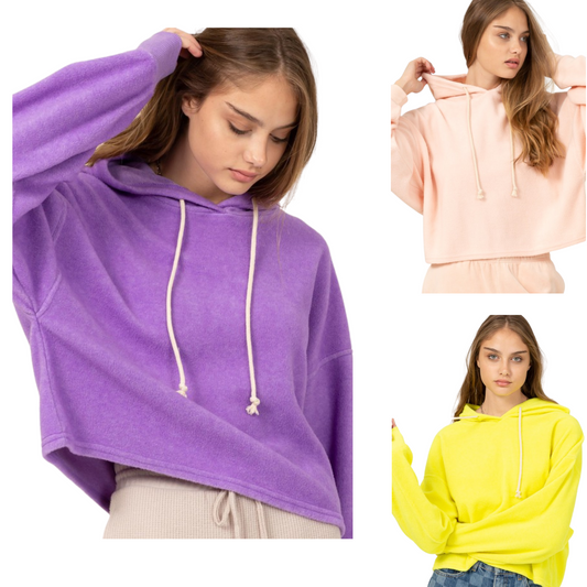 This Oversized Balloon Sleeve Hoodie is perfect for those seeking a comfortable and cozy look. It is made of a soft fabric, available in three colors - lilac fog, lime yellow, and pale pink. Perfect for everyday wear.