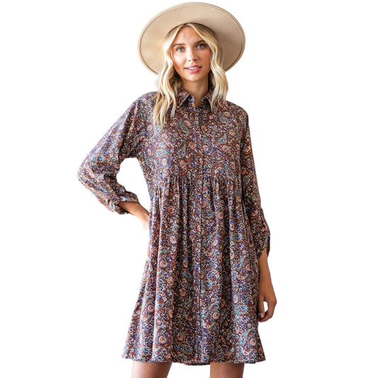 This paisley print babydoll dress will make an elegant addition to your wardrobe. The collar neckline and button tap sleeves make for an inviting aesthetic, while the paisley print provides a timeless, classic look. Bring sophistication to any occasion.